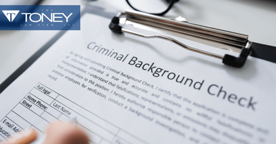 criminal background check paper on clipboard
